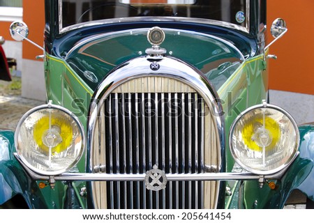 LANDSBERG, GERMANY - JULY 12, 2014: Public oldtimer rally in Bavarian city Landsberg for at least 80 years old veteran cars with a front view of Hotchkiss AM 80, built at year 1930