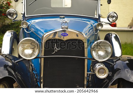 LANDSBERG, GERMANY - JULY 12, 2014: Public oldtimer rally in Bavarian city Landsberg for at least 80 years old veteran cars with a front view of Ford A de Luxe, built at year 1930