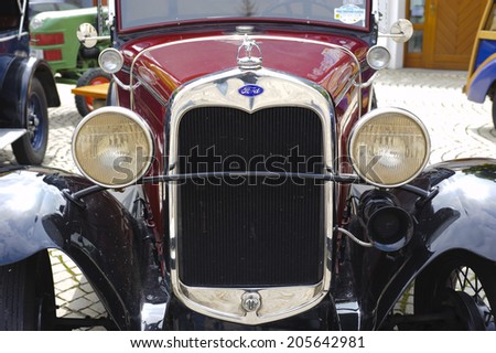 LANDSBERG, GERMANY - JULY 12, 2014: Public oldtimer rally in Bavarian city Landsberg for at least 80 years old veteran cars with a front view of Ford A, built at year 1930