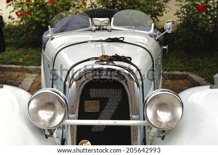 LANDSBERG, GERMANY - JULY 12, 2014: Public oldtimer rally in Bavarian city Landsberg for at least 80 years old veteran cars with a front view of Aero 10, built at year 1929
