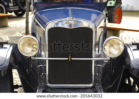 LANDSBERG, GERMANY - JULY 12, 2014: Public oldtimer rally in Bavarian city Landsberg for at least 80 years old veteran cars with a front view of Wanderer W10, built at year 1927
