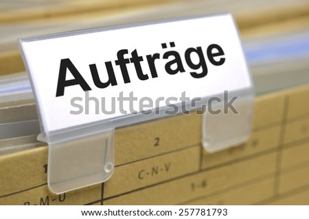 Auftraege printed on file folder in german language - orders