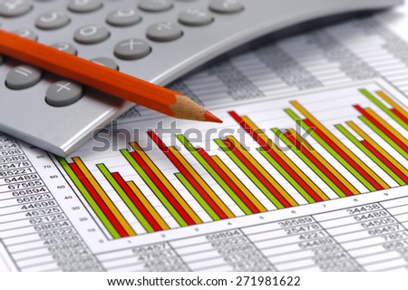 financial chart on table of data and calculator