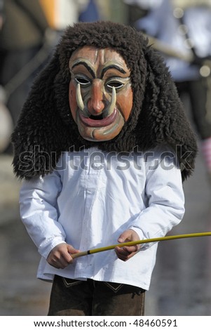 BAD HINDELANG, GERMANY - FEBRUARY 14: Actor with 200 years old historical wooden mask while carnival, February 14, 2010 in Bad Hindelang, Germany, Bavaria
