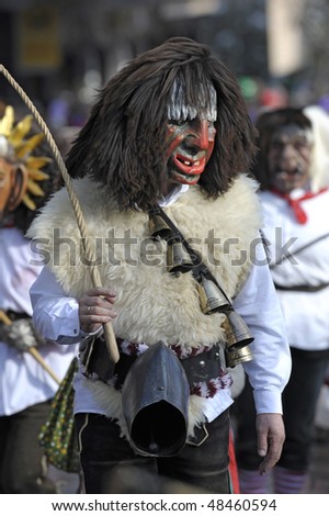 BAD HINDELANG, GERMANY - FEBRUARY 14: Actor with 200 years old historical wooden mask while carnival, February 14, 2010 in Bad Hindelang, Germany, Bavaria