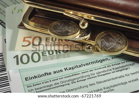 german blank tax return with euro money in purse