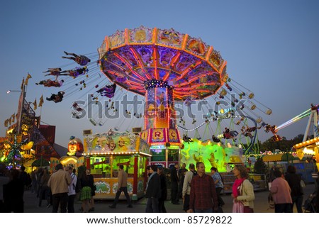 MUNICH, GERMANY - SEPTEMBER 21: chairoplane with flying people of world biggest beer festival \