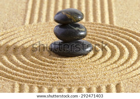 ZEN garden with stacked stones in sand