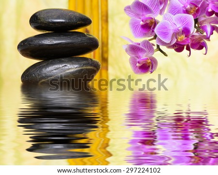 Japanese zen garden with stacked stones and mirroring in water