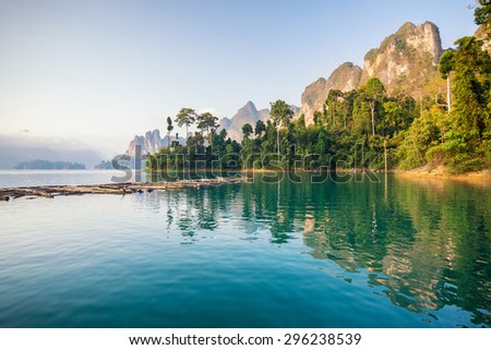 Beautiful mountains lake river sky and natural attractions in Ratchaprapha Dam at Khao Sok National Park, Surat Thani Province, Thailand.