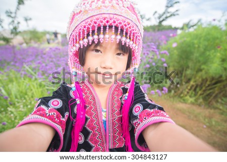 CHIANG MAI, THAILAND - July 25 : Portrait of unidentified hill tribe children smiling with traditional clothes in her village on July 25, 2015 in Chiang Mai, Thailand.