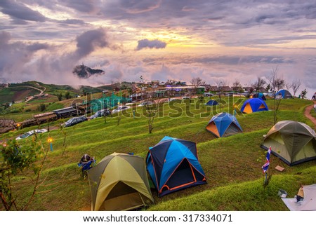 beautiful landscape view point of sea of clouds and tents on a hills at sunrise scene at phu tubberk , petchabun , thailand