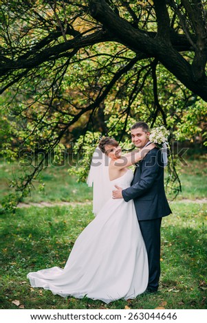 beautiful portrait of the bride and groom in the park