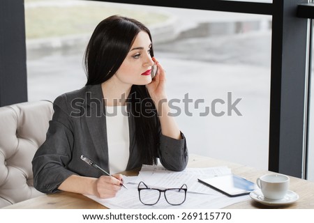 Pretty business lady having a conversation with a client concern