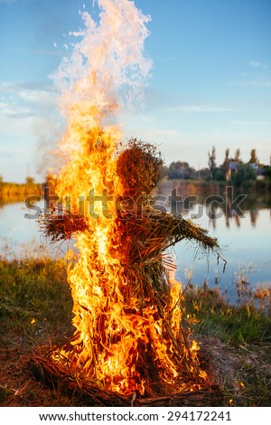 Burning an effigy of straw in the day, 