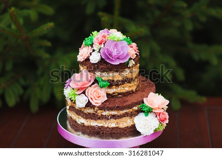 Wedding cake. Naked Wedding cake with flowers