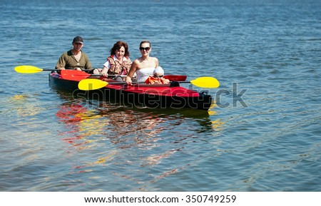 People of all ages in a kayak. Family holiday.