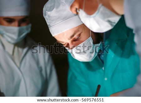 The surgeon makes an operation.