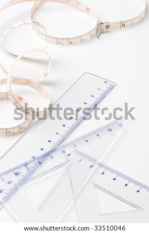Measuring tape, ruler and setsquare