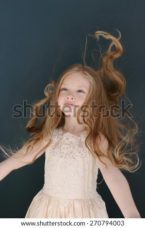 Cute little girl toss up her hairs