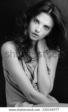 Portrait of beautiful brunette woman looking sophisticated and thoughtfull