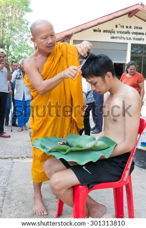NAKHON RATCHASIMA,THAILAND MAY 10 : Male who will be monk cut hair for be Ordained. Thailand on May 10, 2015