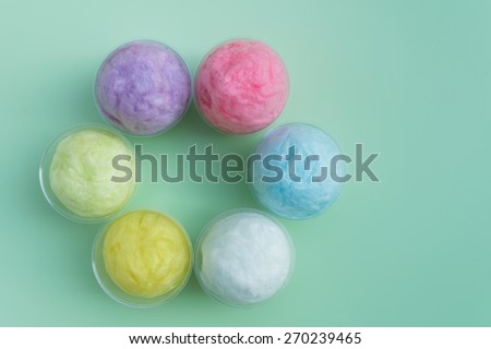 colorful cotton candy in pastel color packed in plastic cup for background
