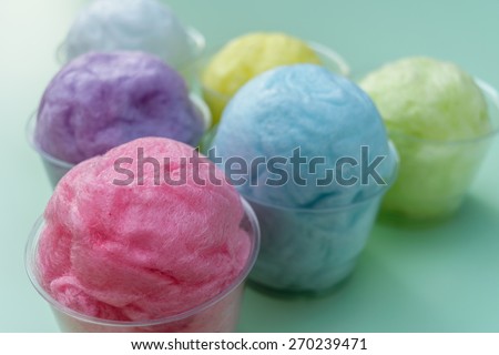 colorful cotton candy in pastel color packed in plastic cup-shallow focus