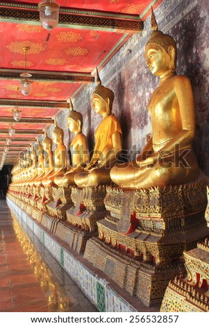 meditation buddha statues in buddhist temple wat suthat, bangkok, thailand