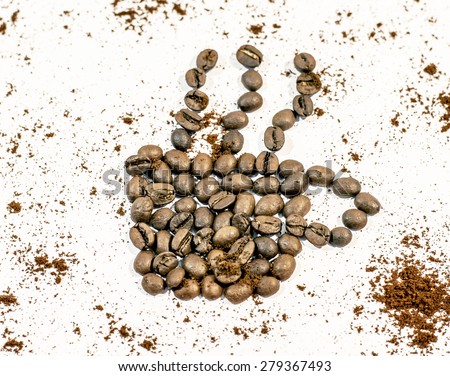 Coffee cup with smoke made from coffee bean sprinkled with fresh coffee on white background
