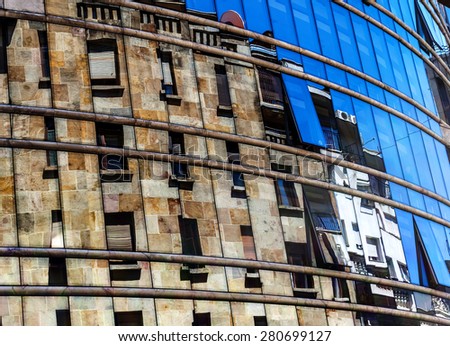 Building reflected in a mirror show-window