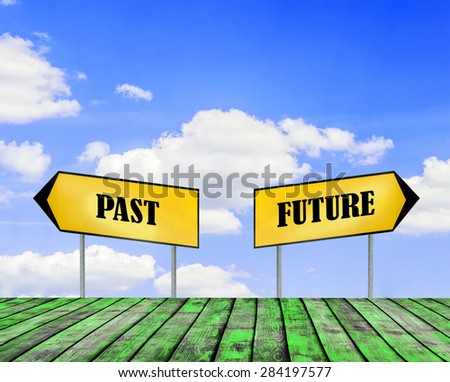 Two street signs FUTURE and PAST with beautiful blue sky with cloud closeup and green wooden floor