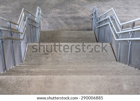 Concrete stairs and metal handrails under the bridge 2