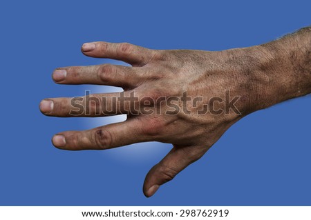 Farmer\'s rough hand isolated on blue and white