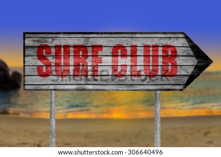 Red Surf Club wooden sign with on a beach background