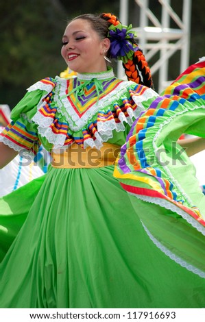 COSTA MESA, CA - JULY 24: Unidentified Mexican dancers perform in traditional costumes on stage at the Orange County State Fair in Costa Mesa, CA on July 24th 2010.