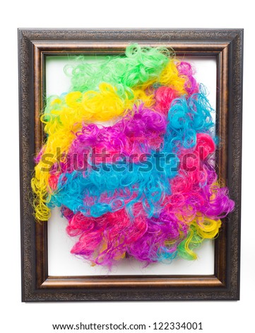 Disco rainbow afro wig framed and hanging on wall