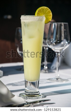 Refereshing lime alcoholic beverage on fine dining restaurant table