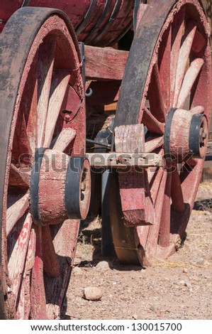 Old West Wagon Wheel outdoors under bright sunlight