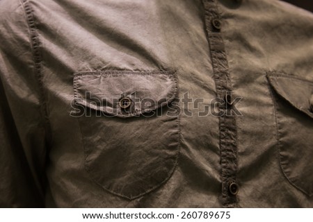 Button on clothes close up -  wear clothes fashion background.