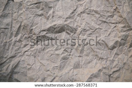 wrinkled paper sheet -  brown paper texture background