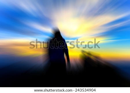 man on hill evening sunset blur abstract background