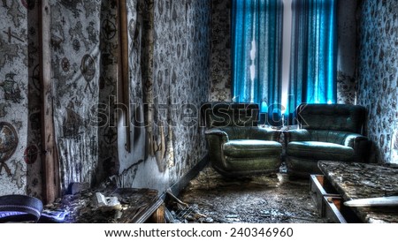 The blue room  In a lost house.  Time and mother nature took back their rights.  But these armchairs seemed to still untouched.  But The Wallpaper has been hit