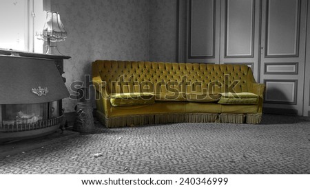 The long green Sofa into a long room. In an abonned house