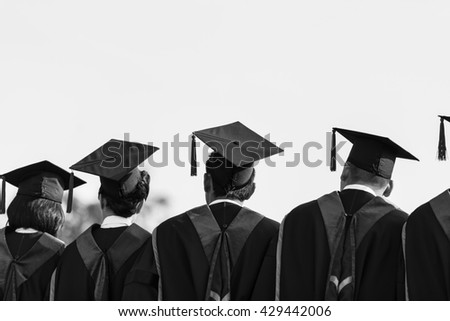 Graduates are stand up in line to get your degree,Graduates cap ,graduation stand up\
,monochrome