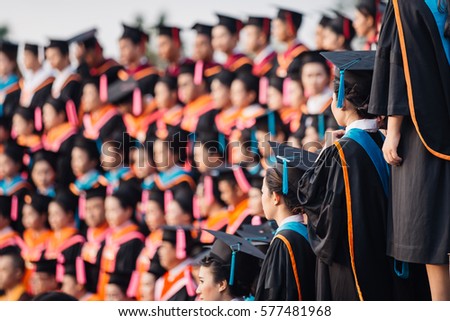 Education, People, Graduate concept - Back of graduates during commencement at university, Close up at graduate cap.graduation ceremony.