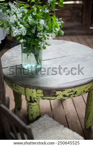 Country style interior of a barn with a round table