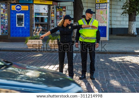 UKRAINE. KIEV - JULY 18, 2015: Police officers, traffic-controllers on the Kiev streets