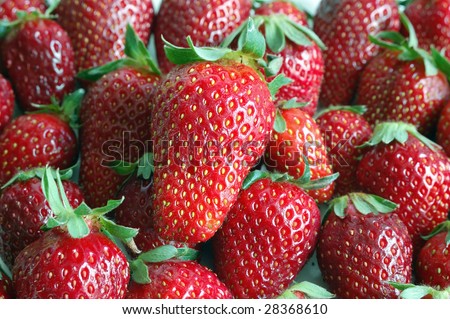 Close up of fresh spring strawberries texture.