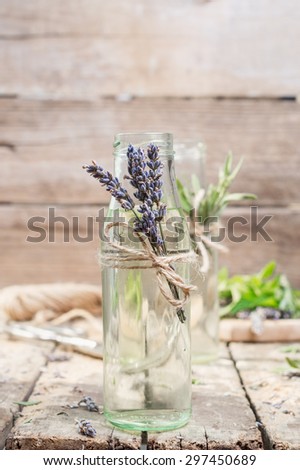 lavender water-detox in glass jars on a rustic wooden background